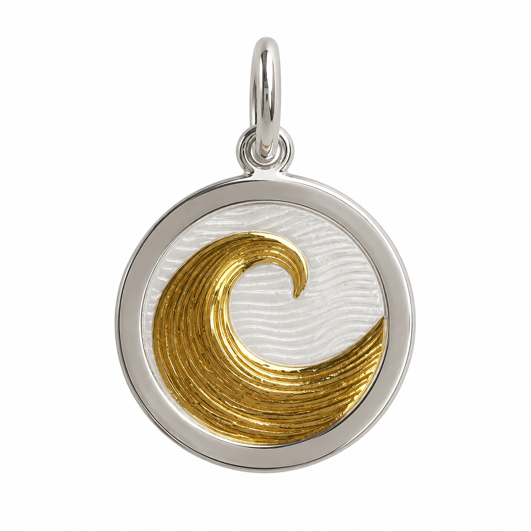 A round sterling silver pendant featuring a textured gold wave design on a white enamel background, with a polished silver border and a top hanging loop.